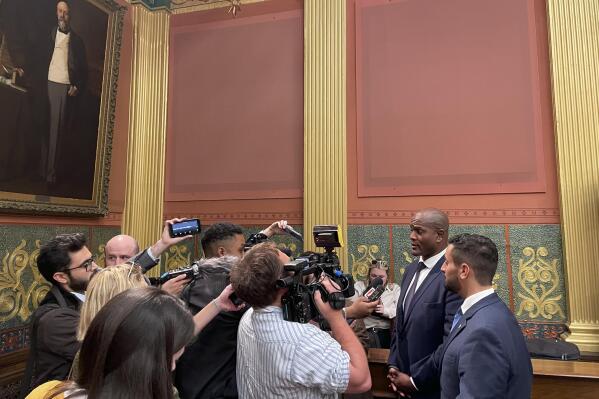 State Rep. Joe Tate, right, talks with reporters after Michigan House Democrats voted to make him the first Black speaker in state history on Thursday, Nov. 10, 2022, in Lansing, Mich. (Joey Cappelletti/Report for America via AP)