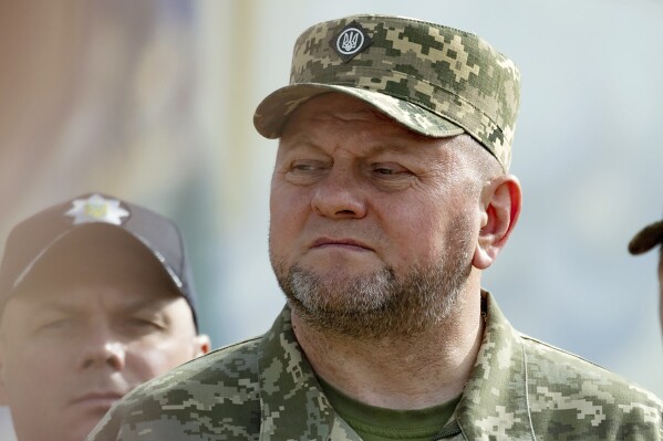 FILE - In this photo provided by the Ukrainian Presidential Press Office, Commander-in-Chief of Ukraine's Armed Forces Valerii Zaluzhnyi, front, attends an event for marking Statehood Day in Mykhailivska Square in Kyiv, on July 28, 2023. Rifts within Ukraine’s top leadership have burst into the open following swirling rumors that Ukraine’s top military chief will be dismissed amid reported tensions with President Volodymyr Zelenskyy. The rumors that Zaluzhnyi was being sacked were denied by Zelenskyy’s office and the Defense Ministry this week and the immensely popular top commander still retains his post. (Ukrainian Presidential Press Office via AP, File)