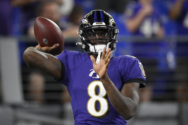 Baltimore Ravens quarterback Lamar Jackson warms up before an NFL football game against the Kansas City Chiefs, Sunday, Sept. 19, 2021, in Baltimore. (AP Photo/Nick Wass)