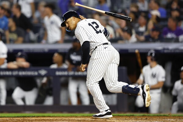 New York Yankees' Trent Grisham tosses his bat after hitting a home run against the Los Angeles Dodgers during the sixth inning of a baseball game, Sunday, June 9, 2024, in New York. (AP Photo/Noah K. Murray)