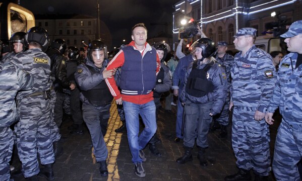 FILE - Police detain Alexei Navalny, a prominent anti-corruption whistle blower and blogger during protests in Moscow, late Tuesday, May 8, 2012 a day after Putin's inauguration. Russian authorities on Friday, Feb. 16, 2023, say Navalny, the fiercest foe of Russian President Vladimir Putin who crusaded against official corruption and staged massive anti-Kremlin protests, died in prison. He was 47. (AP Photo/Sergey Ponomarev, File)