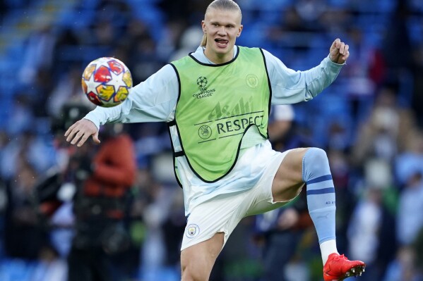 Manchester City's Erling Haaland warms up ahead of the Champions League quarterfinal second leg soccer match between Manchester City and Real Madrid at the Etihad Stadium in Manchester, England, Wednesday, April 17, 2024. (AP Photo/Dave Thompson)