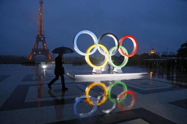 FILE - A display of the Olympic rings is set up on Trocadero plaza that overlooks the Eiffel Tower, after the vote in Lima, Peru, awarding the 2024 Games to the French capital, in Paris, France, Wednesday, Sept. 13, 2017. A proposed French law for the 2024 Paris Olympics that critics contend will open the door for privacy busting video surveillance technology in France and elsewhere in Europe faces an important hurdle Tuesday March 28, 2023 with lawmakers set to vote on it. The bill would legalize the temporary use of so-called "intelligent" surveillance systems to safeguard the Games and Paralympics. (AP Photo/Francois Mori, File)