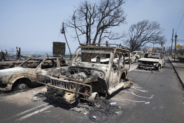 Wildfire wreckage is seen Wednesday, Aug. 9, 2023, in Lahaina, Hawaii. The scene at one of Maui's tourist hubs on Thursday looked like a wasteland, with homes and entire blocks reduced to ashes as firefighters as firefighters battled the deadliest blaze in the U.S. in recent years. (Tiffany Kidder Winn via AP)