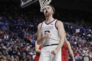 Gonzaga forward Drew Timme celebrates after scoring a basket during the second half of the team's NCAA college basketball game against Saint Mary's, Saturday, Feb. 12, 2022, in Spokane, Wash. Gonzaga won 74-58. (AP Photo/Young Kwak)