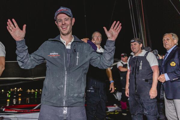 Andoo Comanche Skipper, John Winning Jnr reacts after crossing the finish line to win the Sydney Hobart yacht race in Hobart, Australia, in the early hours of Wednesday, Dec. 28, 2022. (Linda Higginson/AAP Image/Linda Higginson via AP)