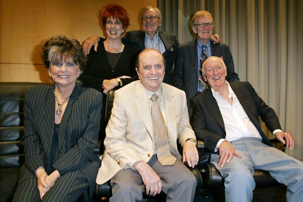 FILE - Bob Newhart, center, poses with members of the cast and crew of the "Bob Newhart Show," from top left, Marcia Wallace, Bill Daily, Jack Riley, and, Suzanne Pleshette, foreground left, and Dick Martin at TV Land's 35th anniversary tribute to "The Bob Newhart Show" on Sept. 5, 2007, in Beverly Hills, Calif. Newhart, the deadpan master of sitcoms and telephone monologues, died in Los Angeles on Thursday, July 18, 2024. He was 94. (AP Photo/Mark J. Terrill, File)