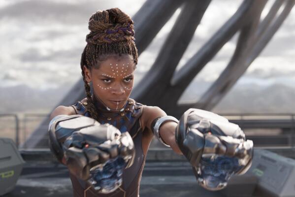 This image released by Disney -Marvel Studios shows Letitia Wright in a scene from "Black Panther." Wright is being treated in a hospital after sustaining minor injuries on the Boston set of “Wakanda Forever.” A Marvel spokesperson says in a statement Wednesday, Aug. 25, 2021, that the incident happened while filming a stunt for the sequel and that she is expected to be released from the hospital soon. Wright is reprising her role as Shuri in “Wakanda Forever,” which is being directed by Ryan Coogler. (Matt Kennedy/Disney/Marvel Studios via AP)