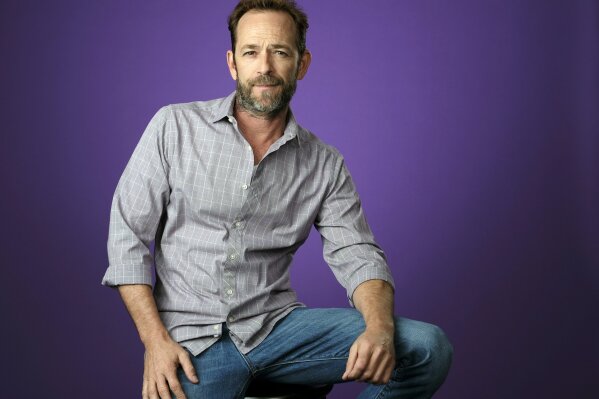 
              FILE - In this Aug. 6, 2018, file photo, Luke Perry poses for a portrait during the 2018 Television Critics Association Summer Press Tour in Beverly Hills, Calif. A publicist for Perry says the "Riverdale" and "Beverly Hills, 90210" star has died. He was 52. Publicist Arnold Robinson said that Perry died Monday, March 4, 2019, after suffering a massive stroke. (Photo by Chris Pizzello/Invision/AP, File)
            