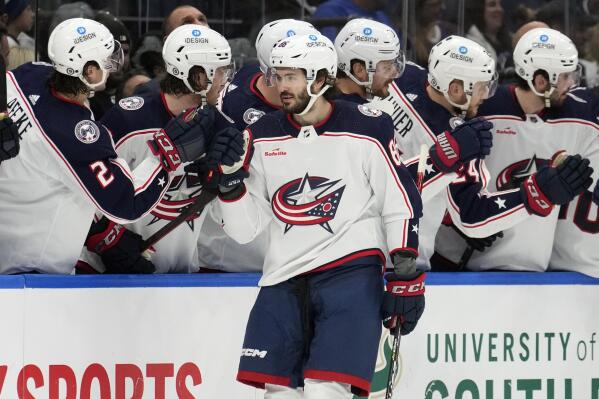 Columbus Blue Jackets right wing Kirill Marchenko (86) celebrates his goal against the Tampa Bay Lightning with the bench during the second period of an NHL hockey game Thursday, Dec. 15, 2022, in Tampa, Fla. (AP Photo/Chris O'Meara)
