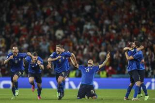 Italy players celebrate after winning the Euro 2020 soccer championship semifinal match against Spain at Wembley stadium in London, England, Tuesday, July 6, 2021. (Carl Recine/Pool Photo via AP)
