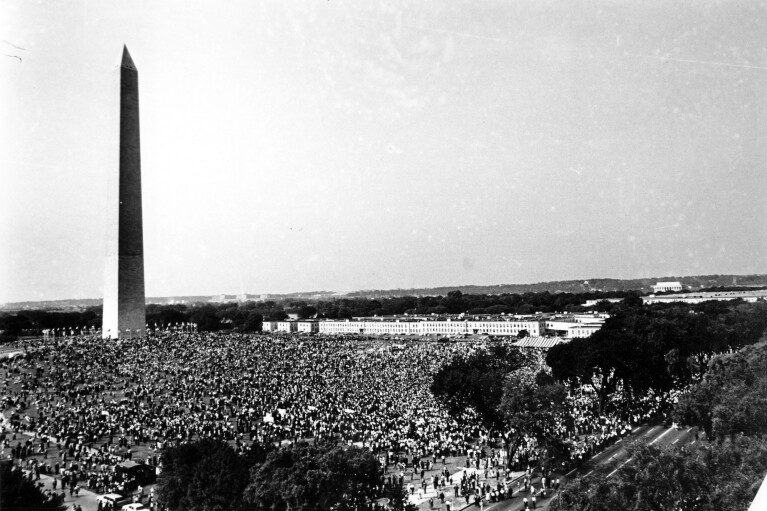 FILE - Civil rights demonstrators gather on the Washington Monument grounds in Washington Aug. 28, 1963. (AP Photo/File)