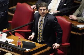 Rep. Justin Lafferty, R-Knoxville, watches the tally board during a vote in the House of Representatives Tuesday, May 4, 2021, in Nashville, Tenn. Lafferty falsely declared that an 18th century policy designating a slave as three-fifths of a person was adopted for "the purpose of ending slavery," commenting amid a debate over whether educators should be restricted while teaching about systematic racism in America. (AP Photo/Mark Humphrey)