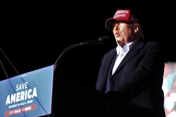 Former President Donald Trump speaks at a rally, Saturday, March 12, 2022, in Florence, S.C. Trump has endorsed two Republicans mounting primary challenges to sitting House members who have been critical of him. (AP Photo/Meg Kinnard)