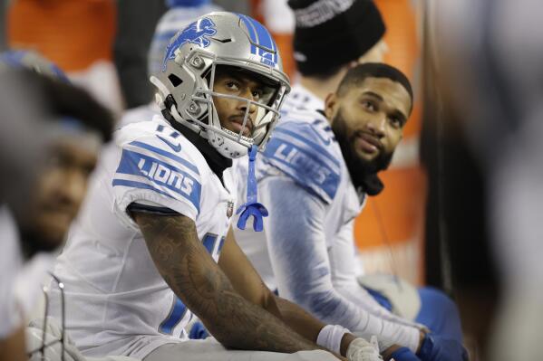 Detroit Lions wide receiver Trinity Benson, left, sits on the bench during the second half of an NFL football game against the Seattle Seahawks, Sunday, Jan. 2, 2022, in Seattle. (AP Photo/John Froschauer)