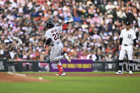 Cleveland Guardians' Bo Naylor (23) celebrates as he circles the bases after hitting a home run against the Detroit Tigers in the third inning of a baseball game Saturday, May 24, 2025, in Detroit. (AP Photo/Lon Horwedel)