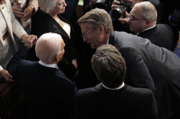 President Joe Biden talks with Rep. Tim Burchett, R-Tenn., as he arrives to delivers the State of the Union address to a joint session of Congress at the U.S. Capitol, Thursday March 7, 2024, in Washington. (AP Photo/Andrew Harnik)