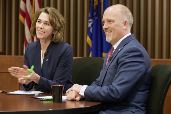 Wisconsin Supreme Court candidates Brad Schimel and Susan Crawford are seen before a debate Wednesday, March 12, 2025, in Milwaukee. (AP Photo/Morry Gash)