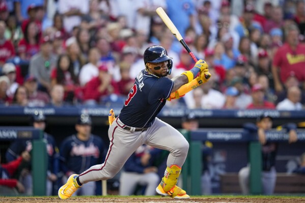 Atlanta Braves' Ronald Acuna Jr. hits a double during the third inning of Game 3 of a baseball NL Division Series against the Philadelphia Phillies Wednesday, Oct. 11, 2023, in Philadelphia. (AP Photo/Matt Slocum)
