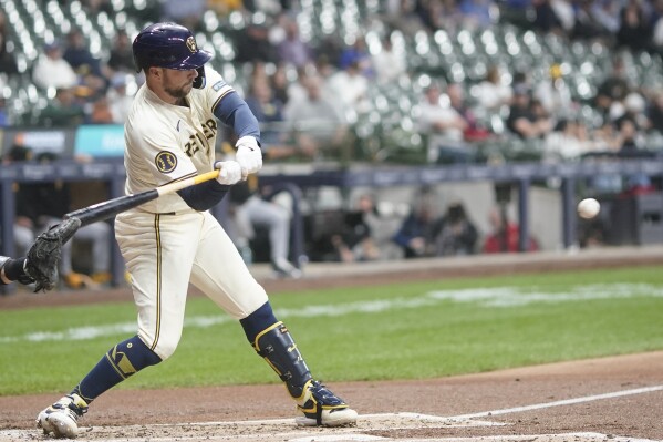 Milwaukee Brewers' Rhys Hoskins hits a single during the second inning of a baseball game against the Pittsburgh Pirates Monday, May 13, 2024, in Milwaukee. (AP Photo/Morry Gash)