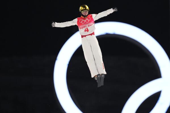 China's Qi Guangpu competes during the men's aerials qualification at the 2022 Winter Olympics, Tuesday, Feb. 15, 2022, in Zhangjiakou, China. (AP Photo/Lee Jin-man)