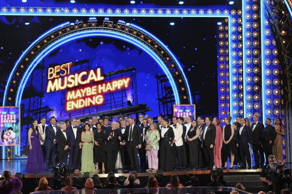 The cast and crew of "Maybe Happy Ending" accept the award for best musical for during the 78th Tony Awards on Sunday, June 8, 2025, at Radio City Music Hall in New York. (Photo by Charles Sykes/Invision/AP)