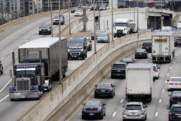 FILE - Motor vehicle traffic moves along the Interstate 76 highway in Philadelphia, March 31, 2021. Dozens of Republican attorneys general on Monday, May 13, 2024, took legal action against the Biden Administration and California over new emissions limits for trucks. (AP Photo/Matt Rourke, File)