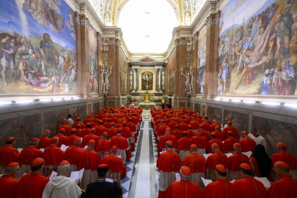Cardinals gather in the Pauline Chapel before they form a procession to enter the Sistine Chapel at the Vatican to start the conclave to elect the successor of late Pope Francis, Wednesday, May 7, 2025. (Vatican Media via AP)