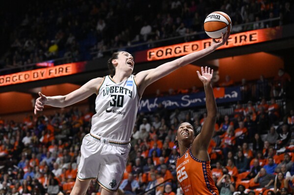 New York Liberty forward Breanna Stewart (30) reaches for a rebound against Connecticut Sun forward Alyssa Thomas (25) during the first half of Game 3 of a WNBA basketball semifinal playoff series Friday, Sept. 29, 2023, in Uncasville, Conn. (AP Photo/Jessica Hill)