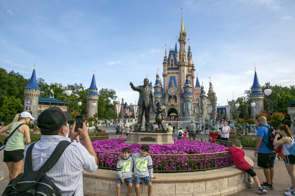 People visit the Magic Kingdom Park at Walt Disney World Resort in Lake Buena Vista, Fla., April 18, 2022. (AP Photo/Ted Shaffrey, File)
