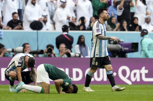 FILE - Argentina's Lionel Messi leaves the pitch after losing the World Cup group C soccer match between Argentina and Saudi Arabia at the Lusail Stadium in Lusail, Qatar, on Nov. 22, 2022. Saudi Arabia’s path to the 2026 World Cup being played in North America will start in a first qualifying group drawn Thursday with neighboring Jordan, Tajikistan plus either Cambodia or Pakistan. (AP Photo/Natacha Pisarenko, File)