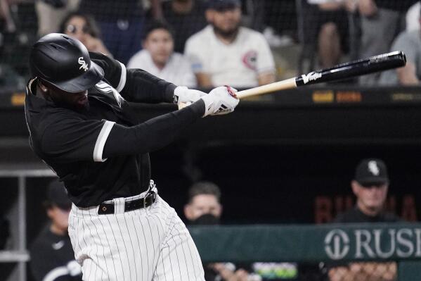 Chicago White Sox's Luis Robert hits a winning one-run single against the New York Yankees during the ninth inning of a baseball game in Chicago, Saturday, May 14, 2022. (AP Photo/Nam Y. Huh)