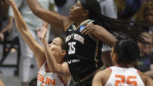 Connecticut Sun's Rebecca Allen (9) and New York Liberty's Jonquel Jones (35) reach for a rebound during the first half of a WNBA basketball game Tuesday, June 27, 2023, in Uncasville, Conn. (Sarah Gordon/The Day via AP)