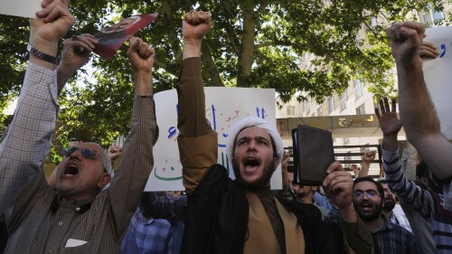 Demonstrators chant slogans during a protest of the burning of a Quran in Sweden, in front of the Swedish Embassy in Tehran, Iran, Friday, June 30, 2023. A Quran burning and a string of requests to approve the destruction of more holy books have left Sweden torn between its commitment to free speech and its respect for religious minorities. The clash of fundamental principles has complicated Sweden's desire to join NATO. (AP Photo/Vahid Salemi)