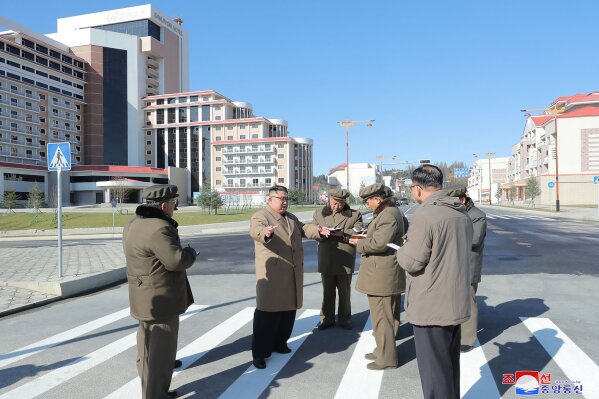 In this undated photo provided on Wednesday, Oct. 16, 2019, by the North Korean government, North Korean leader Kim Jong Un, second left, visits a construction site in Samjiyon County, North Korea. Independent journalists were not given access to cover the event depicted in this image distributed by the North Korean government. The content of this image is as provided and cannot be independently verified. Korean language watermark on image as provided by source reads: "KCNA" which is the abbreviation for Korean Central News Agency. (Korean Central News Agency/Korea News Service via AP)