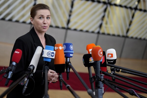 Denmark's Prime Minister Mette Frederiksen speaks with the media as she arrives for an EU summit at the European Council building in Brussels, Thursday, Dec. 14, 2023. European Union leaders, in a two-day summit will discuss the latest developments in Russia's war of aggression against Ukraine and continued EU support for Ukraine and its people. (AP Photo/Virginia Mayo)