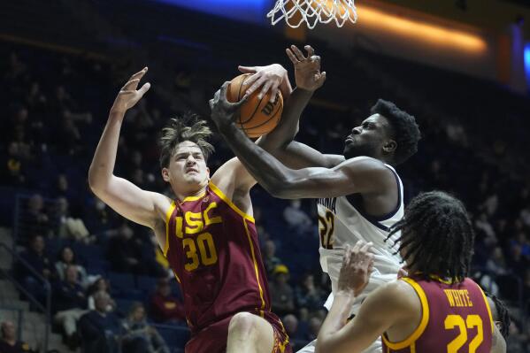 Southern California forward Harrison Hornery (30) and California forward ND Okafor (22) compete for a rebound during the first half of an NCAA college basketball game in Berkeley, Calif., Wednesday, Nov. 30, 2022. (AP Photo/Godofredo A. Vásquez)