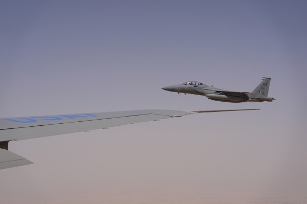Royal Saudi Air Force F-15s provide an honorary escort for Air Force One, with President Donald Trump aboard, as it arrives in Saudi Arabia, Tuesday, May 13, 2025. (AP Photo/Alex Brandon)