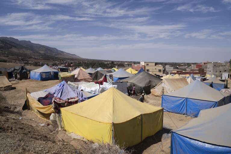 Tents housing people who were displaced by the earthquake are seen in the town of Amizmiz, outside Marrakech, Morocco, Friday, Oct. 6, 2023. (AP Photo/Mosa'ab Elshamy)