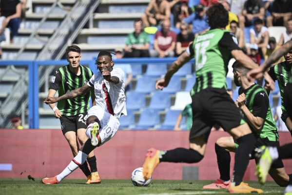 Milan's Rafael Leao, second left, scores their side's first goal of the game during the Serie A soccer match between Sassuolo and Milan at Mapei Stadium in Sassuolo, Italy, Sunday April 14, 2024 (Massimo Paolone/LaPresse)