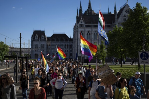Hungarians march in downtown Budapest to protest against a new law banning LGBTQ+ Pride events and the populist government's restriction on assembly rights, which many critics of Prime Minister Viktor Orbán see as a crackdown on their freedom on Thursday, May 1, 2025. (AP Photo/Denes Erdos, File)
