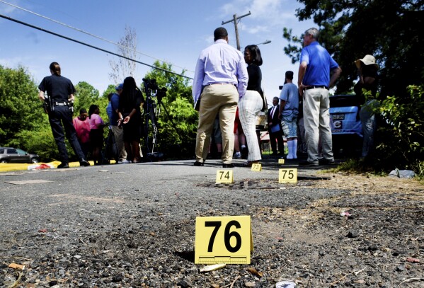 Additional bullet casings left are mared behind the morning press conference on Wednesday morning, July 5, 2023, after a shooting in Shreveport, La. Shreveport police search the scene of a shooting, Wednesday morning, July 5, 2023 in Shreveport, La. At least three people were killed and 10 others wounded late Tuesday night, Shreveport police Sgt. Angie Willhite said. One of the injured was in critical condition Wednesday but the others were expected to survive, she said. No arrests have been made. (Henrietta Wildsmith /The Shreveport Times via AP)