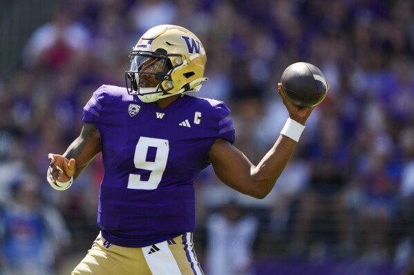 Washington quarterback Michael Penix Jr. (9) throws during the first half of an NCAA college football game against Boise State, Saturday, Sept. 2, 2023, in Seattle. (AP Photo/Lindsey Wasson)