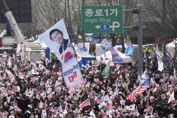 Supporters of impeached South Korean President Yoon Suk Yeol stage a rally to oppose his impeachment in Seoul, South Korea, Saturday, March 8, 2025. (AP Photo/Ahn Young-joon)