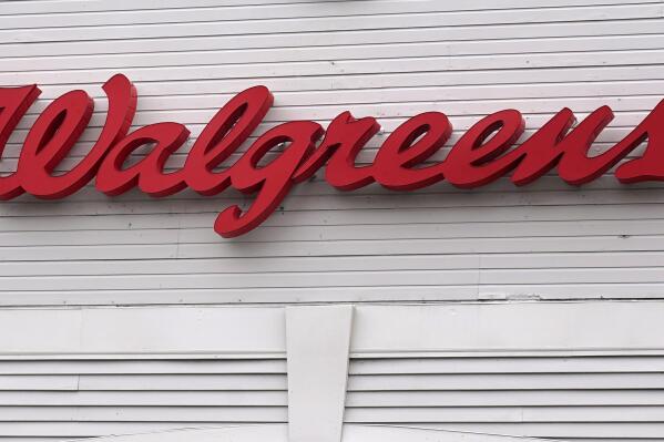 FILE - The Walgreens logo on the front of a store, July 14, 2021, in Cambridge, Mass. A huge opioid settlement dragged Walgreens to a $3.7 billion loss in its fiscal first quarter, but the drugstore chain still beat Wall Street forecasts. The company also reaffirmed its earnings forecast for the new year. Walgreens said Thursday, Jan. 5, 2023 that it recorded a $5.2-billion, after-tax charge in the quarter that ended November 30 for opioid-related litigation. (AP Photo/Charles Krupa, File)