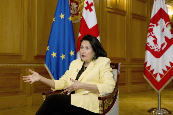 Georgian President Salome Zourabichvili gestures while speaking during an interview with The Associated Press, in Tbilisi, Georgia, Thursday, May 16, 2024. Zourabichvili said Thursday that a "foreign influence" bill passed by parliament that critics call a threat to free speech is "unacceptable." (AP Photo/Shakh Aivazov)