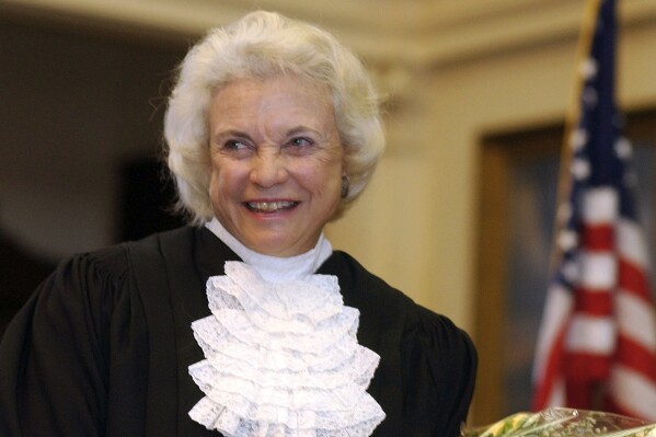 FILE - Supreme Court Justice Sandra Day O'Connor is shown before administering the oath of office to members of the Texas Supreme Court in Austin, Texas, on Jan. 6, 2003. For more than a decade, O'Connor was the only woman on the Supreme Court. And she was the first. Now the court has a record four. (AP Photo/Harry Cabluck, File )