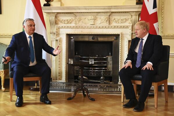 British Prime Minister Boris Johnson, right, welcomes Hungarian President Viktor Orban for talks, at 10 Downing Street, London, Friday, May 28, 2021. Boris Johnson is meeting Friday with Hungarian President Viktor Orban, amid criticism of the decision to invite the hardline European leader to 10 Downing St. Johnson’s office said it was a routine meeting with the leader of a major European Union nation. (Leon Neal/PA via AP)
