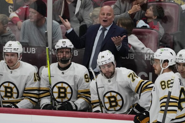 Boston Bruins head coach Jim Montgomery reacts to a call during the first period of an NHL hockey game against the Florida Panthers, Wednesday, Nov. 22, 2023, in Sunrise, Fla. (AP Photo/Marta Lavandier)