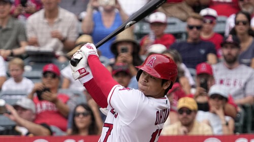 Los Angeles Angels' Shohei Ohtani follows through as he hits a solo home run during the first inning of a baseball game against the Pittsburgh Pirates, Sunday, July 23, 2023, in Anaheim, Calif. (AP Photo/Mark J. Terrill)